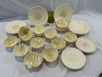 All pieces arranged together on white backdrop with green apple for scale