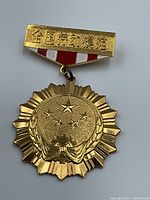 Front view of medal and enamel suspension bar on grey background
