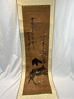 Unrolled view of entire scroll showing artwork and calligraphy