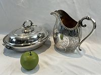 Pitcher and lidded serving dish with green apple for scale