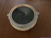 Top view of the ceramic casserole baking dish showing interior glaze and unglazed rim.