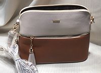 Front view of the beige and brown Lovevook crossbody purse with zipper and tassel detail and wrapped strap