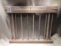 Whole view of the wooden pasta dryer rack with multiple dowels for drying pasta.