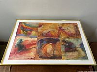 Full view of framed abstract painting by Roman Svoboda with six colorful square sections in varied warm and cool colors, mounted on wall.