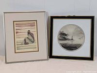 Two framed prints side by side: left is Native American art print of two women, right is Asian round landscape print