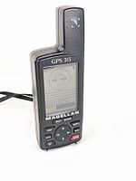 Front view of the Magellan GPS 315 handheld GPS device showing screen and navigation buttons.