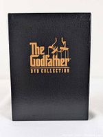 Front of black slipcase with gold The Godfather DVD Collection logo