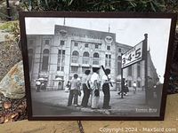 Framed black and white photograph titled 'Yankee Boys' showing boys outside Yankee Stadium, dark brown frame with glass