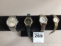 Four watches displayed together, showing variety of size and style.
