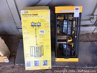 Box and cagelight unit showing the product and packaging details for a 1000 watt halogen cagelight with stand