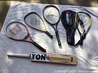 Image showing one Ton cricket bat, one Wilson tennis racket, one Pro Kennex racquetball racket, two Ektelon racquetball rackets, and two Ektelon black racket cases