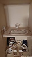 Photo showing Aynsley 3.5" vase, Paragon rectangular platter and matching cup on shelf