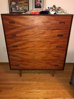 Front view of teak dresser