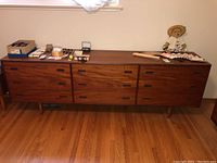 Full front view of dresser with items on top