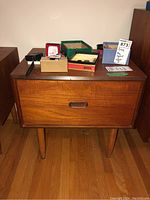 Overall front view of teak night stand showing single drawer, top surface with leftover items removed.