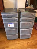 Front view of two Gracious Living plastic storage units side by side showing 5 translucent drawers in each and dark gray frame.