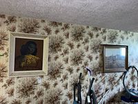 Framed portrait of an Asian woman hanging on textured wallpapered wall showing full print and frame.