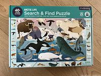 Box of Arctic Life Search & Find puzzle showing colorful illustrations of Arctic animals and 64-piece count.