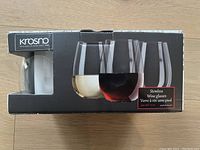 Box showing Krosno brand and an image of the stemless wine glasses set.