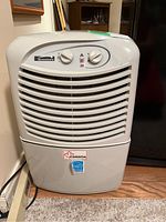 Front view of Kenmore dehumidifier showing brand and control panel.