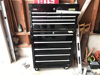 Front view of entire two-section tool chest set showing drawer layout and caster base.