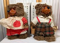 Front view of Jack and Jill Raikes Bears showing attire and boxes behind