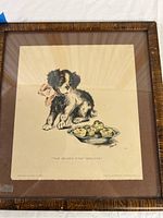 Full view of the framed vintage dog biscuit print showing the dog, biscuits, and frame condition.