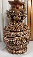 Front view of the owl cookie jar showing the detailed face, embossed 'COOKIES' text, and glaze finish.