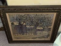 Framed antique print titled 'Winter Street Scene' by Phillipe Marchand showing a winter street with houses and leafless trees in muted tones, with detailed ornate dark carved frame.