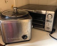 Side view of Cuisinart rice cooker with Breville toaster oven in background