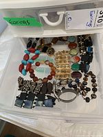 Drawer with assorted beaded and wooden bracelets in various colors and designs