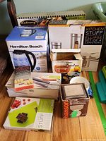 Photo showing Hamilton Beach glass kettle, Culinary Essentials roasting pan, Kitchen Stuff canister set, Hanson mini scale box, and Kitchen Stuff digital scale box.