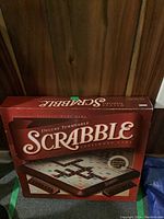 Box of Deluxe Turntable Scrabble game showing front with branding and game board image
