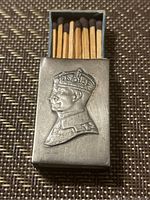 Open sterling silver match case showing embossed crowned profile of Edward VIII and wooden matches inside.