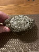 Front view of rhinestone purse showing detailed floral rhinestone clasp.