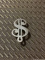 Front view showing dollar sign design of the sterling silver money clip