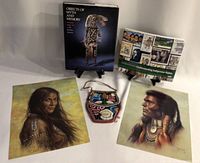 Photo showing the full lot including two books standing, the beaded bag in front center, and two prints on left and right sides.