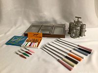 Photo of the mid-century modern serving dish, condiment set, fondue forks, and small forks boxed