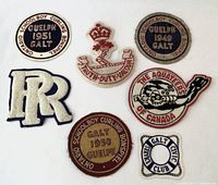Collection of seven distinct embroidered vintage patches laid out on a white background: several circular curling patches dated 1949, 1950, 1951; an intertwined RR military insignia; a shield-shaped club patch; a crown with text patch; and a diving aquateers patch.