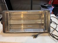Photo of the Marvin shop heater powered off showing heating elements and grille