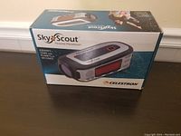 Closed product box showing SkyScout branding and image of device