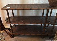 Full view of the 3-tier rattan shelf unit showing structure and tiers.