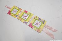 Set of three connected square photo frame wall hangers with pink ribbon for wall hanging, floral pattern, 5x5 inches each