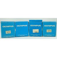 Four blue Olympus boxes labeled 5078, containing the darkfield stops, showing manufacturer's packaging.