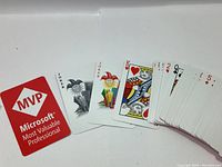 Playing cards fanned out showing Microsoft MVP branded card, jokers, and face cards.