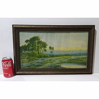 Framed print art landscape with Coca-Cola can to show scale, featuring green trees, field of flowers, pond, wooden frame dark brown color.