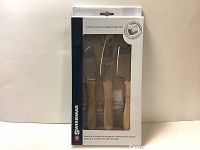 Photo of boxed new Swissmar 3-piece acacia wood cheese knife set showing knives inside transparent window on front.