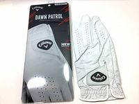 Front side of Callaway Dawn Patrol golf glove and packaging showing logo and glove details.