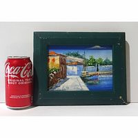 The framed oil painting with a Coca-Cola can for size reference, showing the scene and condition of the frame.