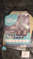 Packaged set of FH Group Deluxe Comfort fabric car seat covers showing product branding and features.